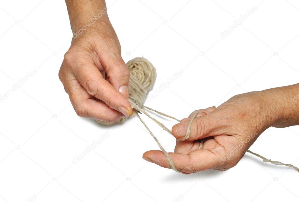 Hands of an old woman, knitting