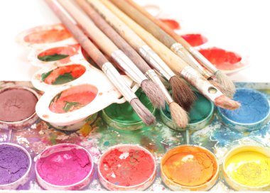 Brushes, paints and palette clipart