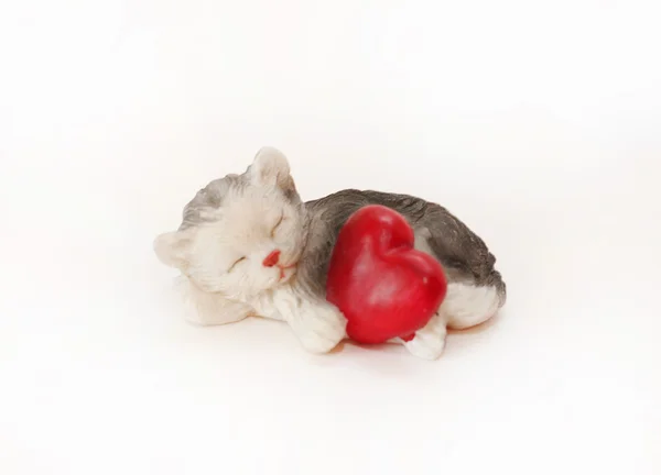Figure of a cat with heart on a white ba — Stock Photo, Image