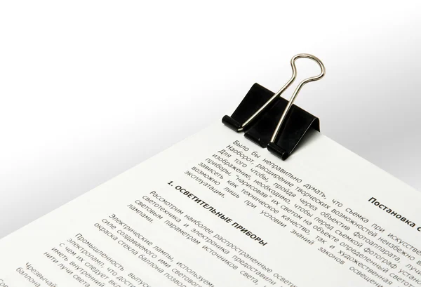 Papers fastened by a binder clip — Stock Photo, Image