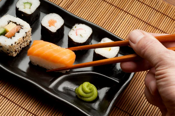 Kézi wirh sushi — Stock Fotó