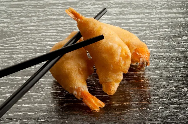 Fried shrimp with chopsticks — Stock Photo, Image