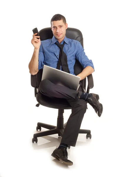 Hombre con teléfono y portátil — Foto de Stock