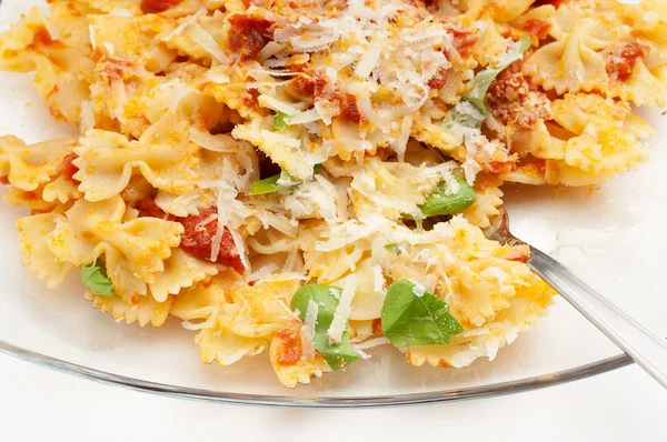 Tomatoes farfalle and parmesan cheese — Stock Photo, Image