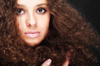Girl with curly hair, close-up clipart