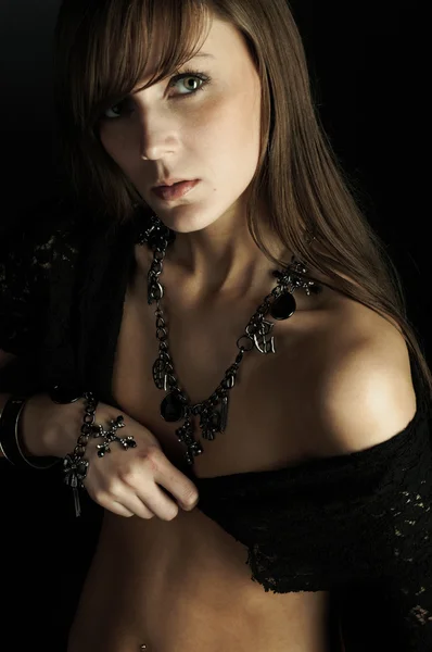 Beautiful young woman on black — Stock Photo, Image