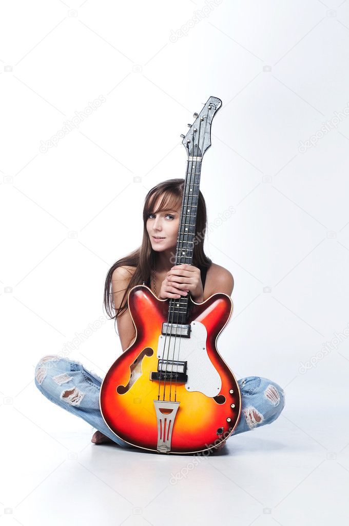 Attractive female holding a guitar