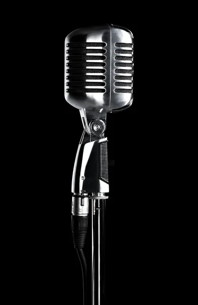 Retro microphone on stand on black Stock Picture