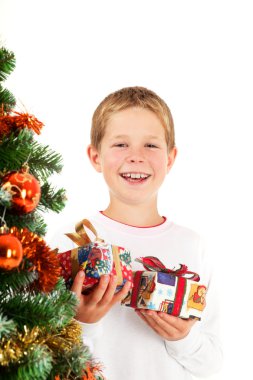 Young boy and christmas presents clipart