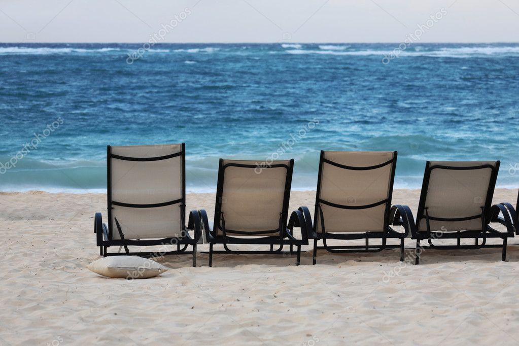 Lounge chairs on beach Stock Photo by ©diktattoor 1883828