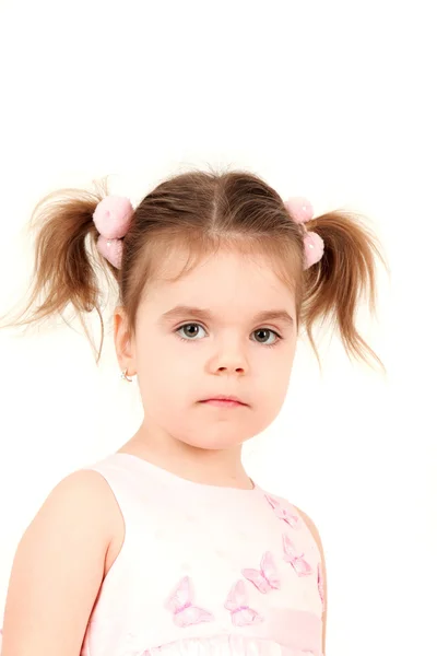 Маленькая девочка с косичками — стоковое фото