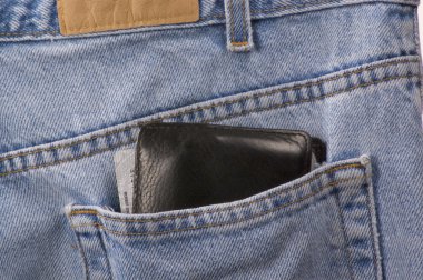 Closeup of denim blue jeans with wallet clipart