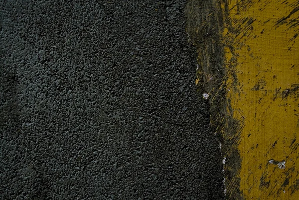 Black tarmac and yellow road marking — Stock Photo, Image