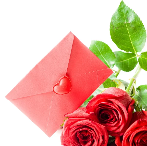 赤い封筒と赤いバラ ストックフォト