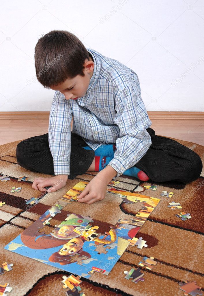 Boy playing puzzle