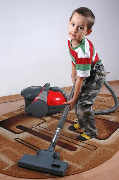 Boy dust with vacuum cleaner — Stock Photo, Image