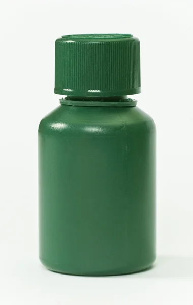 Verde botella de píldoras de plástico — Foto de Stock