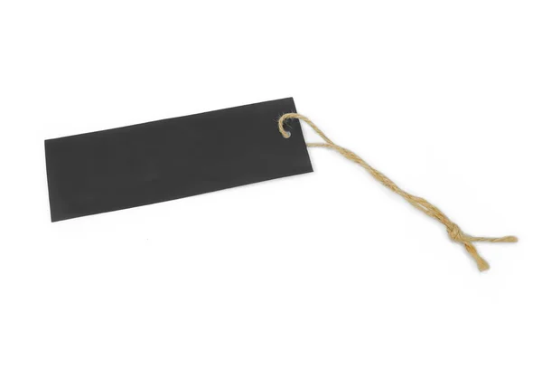 Пустой черный ярлык, завязанный коричневой ниткой — стоковое фото