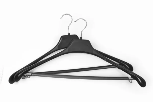 Two black plastic coat hangers — Stock Photo, Image