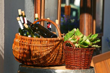Baskets with bottles of wine and salads clipart