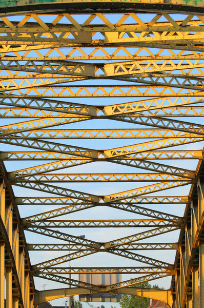 Girder of an old yellow steel bridge