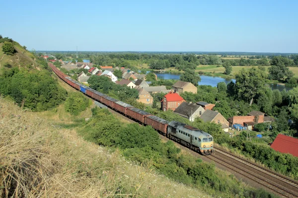 Landscape with the train, village and ri — Stock Photo, Image