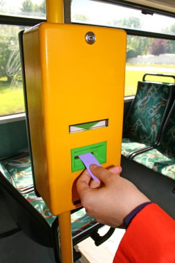 Validating a bus ticket clipart