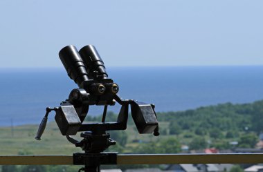Binocular at a top of the tower clipart