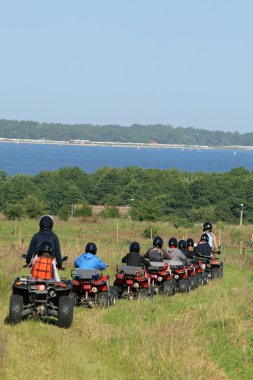 Buggy excursion at the seashore clipart