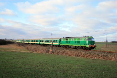 Passenger train passing through countrys clipart