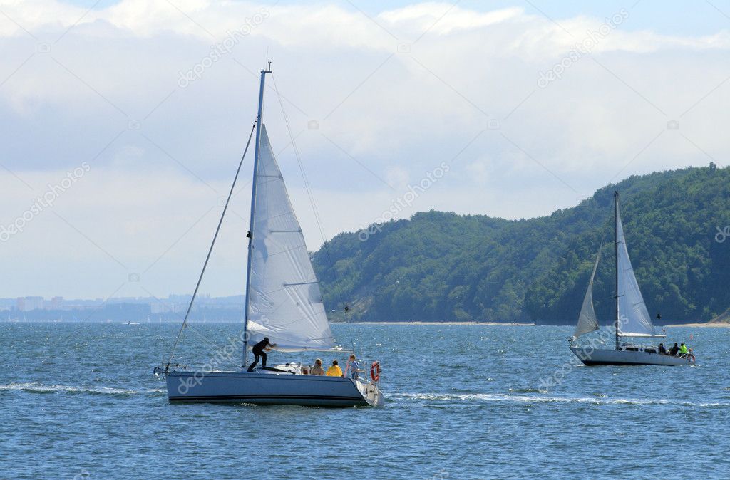 Two sailboats floating on the sea