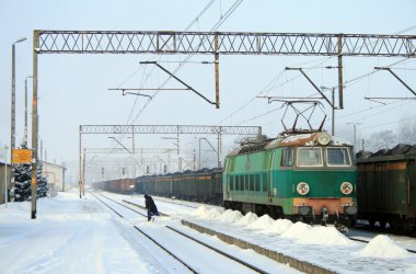 Heavy winter at the railway station clipart