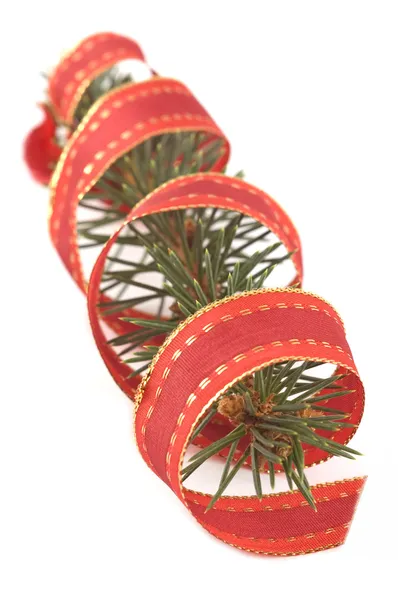 Pine branch with a christmas ribbon — Stock Photo, Image