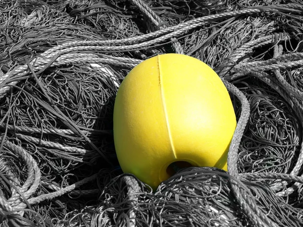 Yellow buoy and ropes — Stock Photo, Image