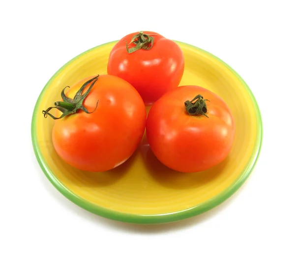 Tomates en un plato amarillo — Foto de Stock