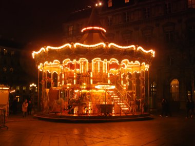 Merry-go-round in the night clipart