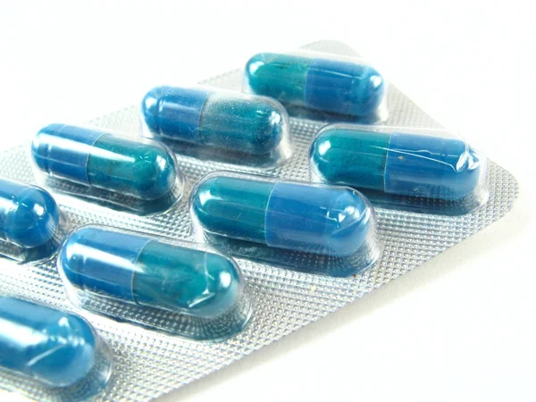 Niebieskie tabletki — Zdjęcie stockowe