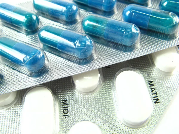 Blue and white pills — Stock Photo, Image