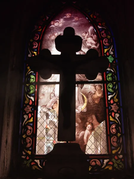 stock image Cross in front of a stained glass