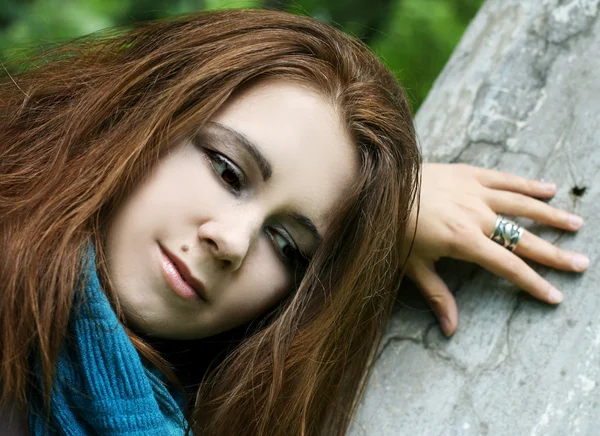 Portrait of young woman in blue scarf — Stock Photo, Image