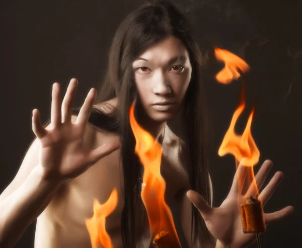 Portrait of asian man with fire — Stock Photo, Image