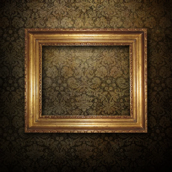 Quadro dourado sobre papel de parede grunge — Fotografia de Stock