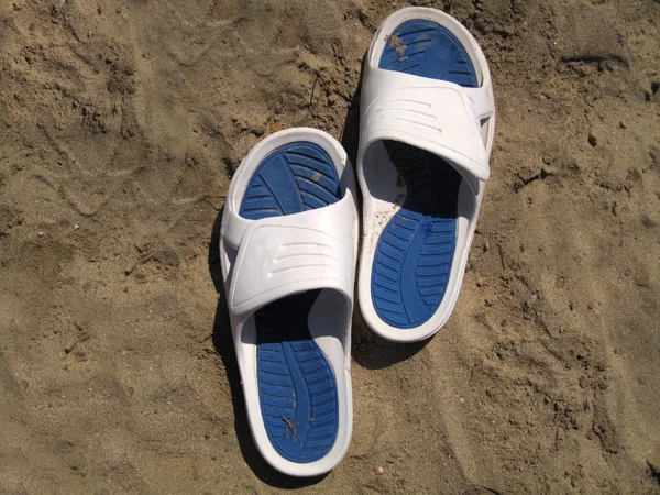 Sandal on sand background — Stock Photo, Image