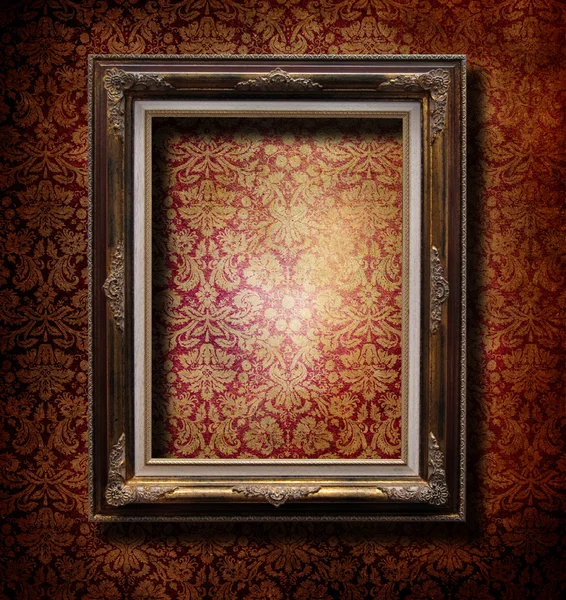 Wooden frame over grunge wallpaper — Stock Photo, Image