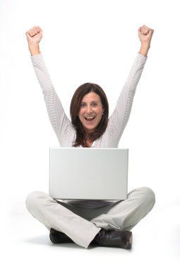 Woman working on a laptop clipart