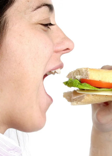 Stock image Woman eating a sandwich