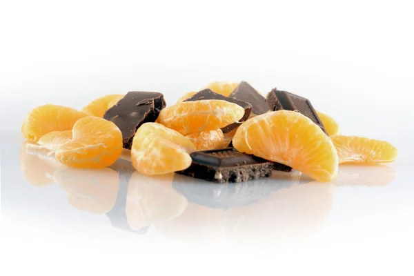 Mandarynki i czekoladki — Zdjęcie stockowe