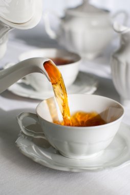 Pouring tea. clipart