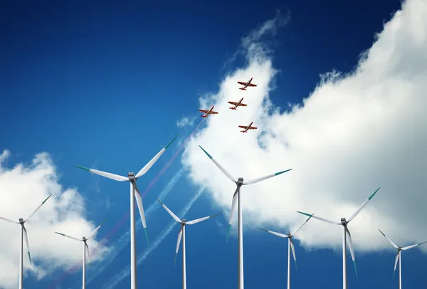 Wind turbines and air show — Stock Photo, Image