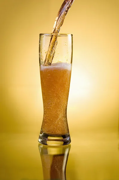 Glass of beer close-up with froth over — Stock Photo, Image